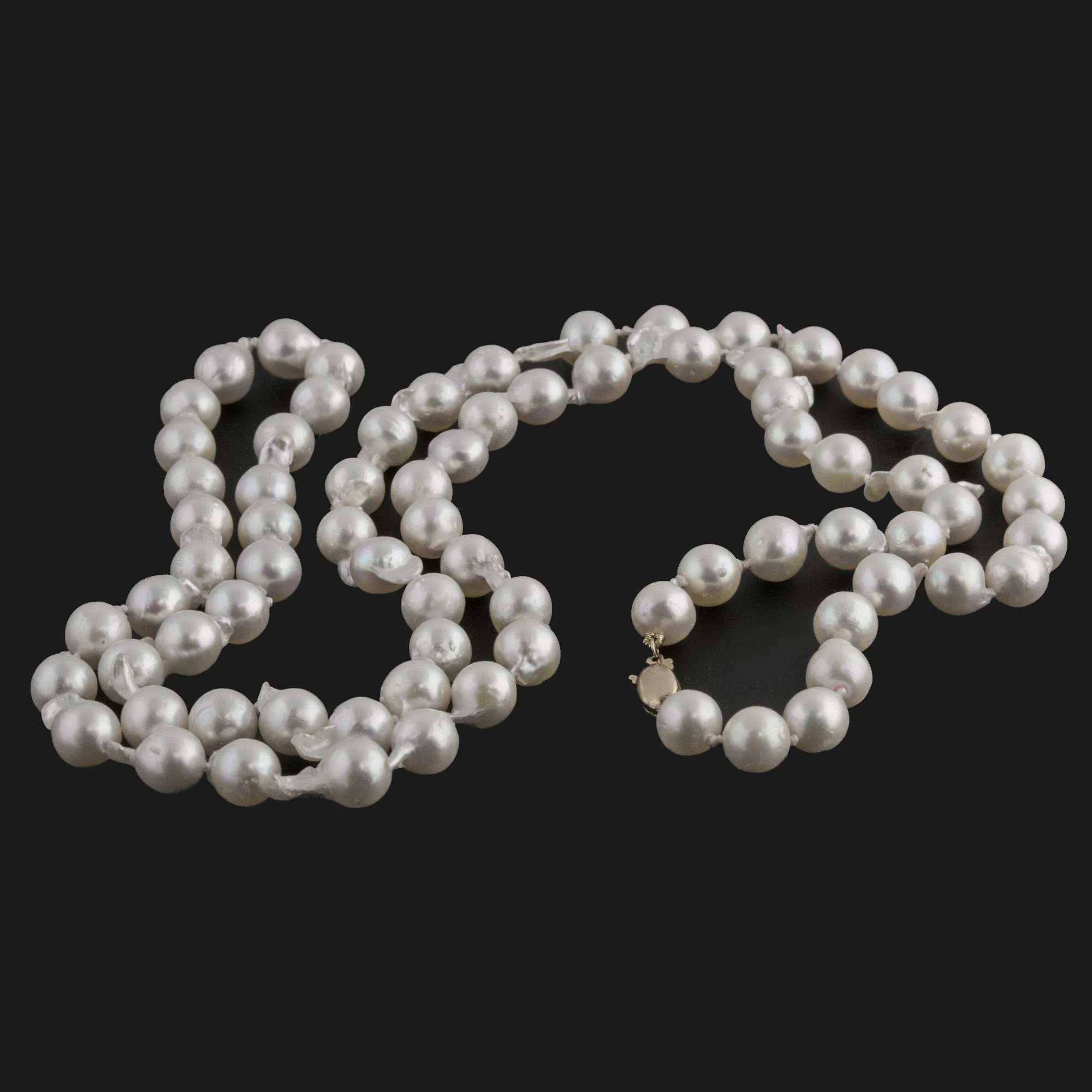 Semi-baroque Japanese Akoya Necklace, cultured 9mm pearls, 35 inches. 14kt clasp. C. 1950s. j-nlbd1273
