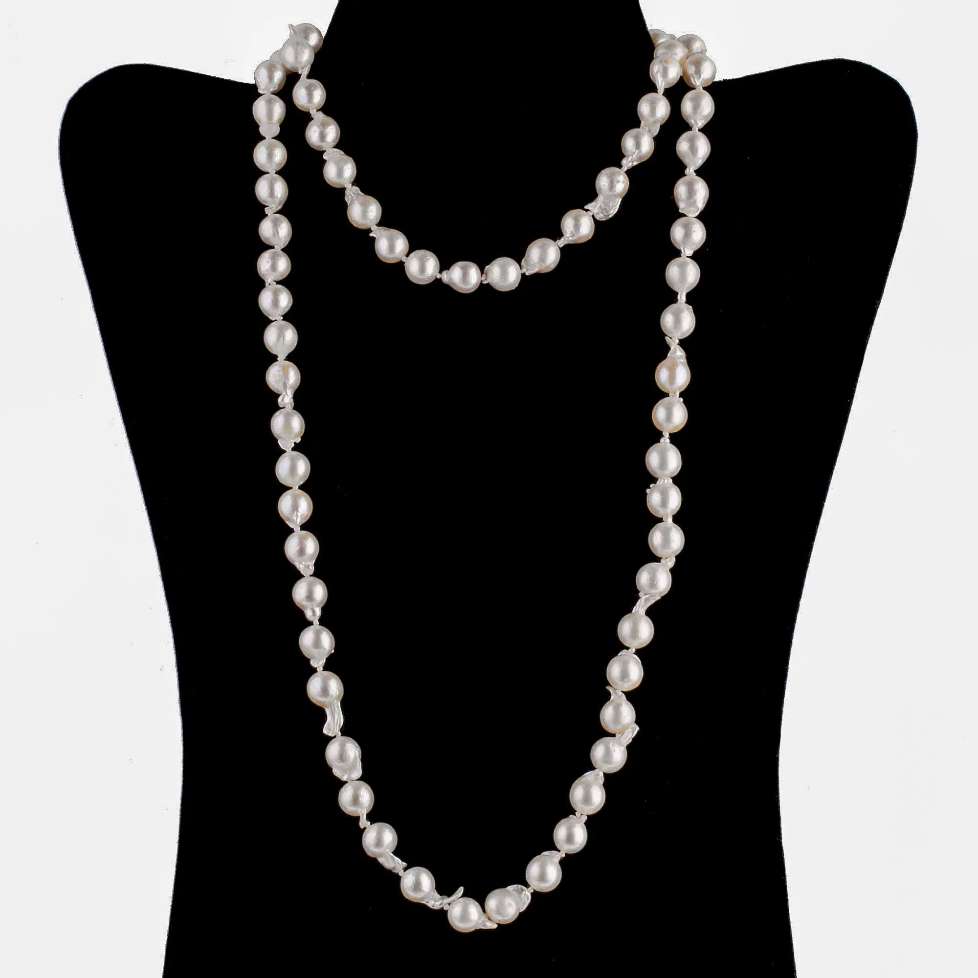 Semi-baroque Japanese Akoya Necklace, cultured 9mm pearls, 35 inches. 14kt clasp. C. 1950s. j-nlbd1273